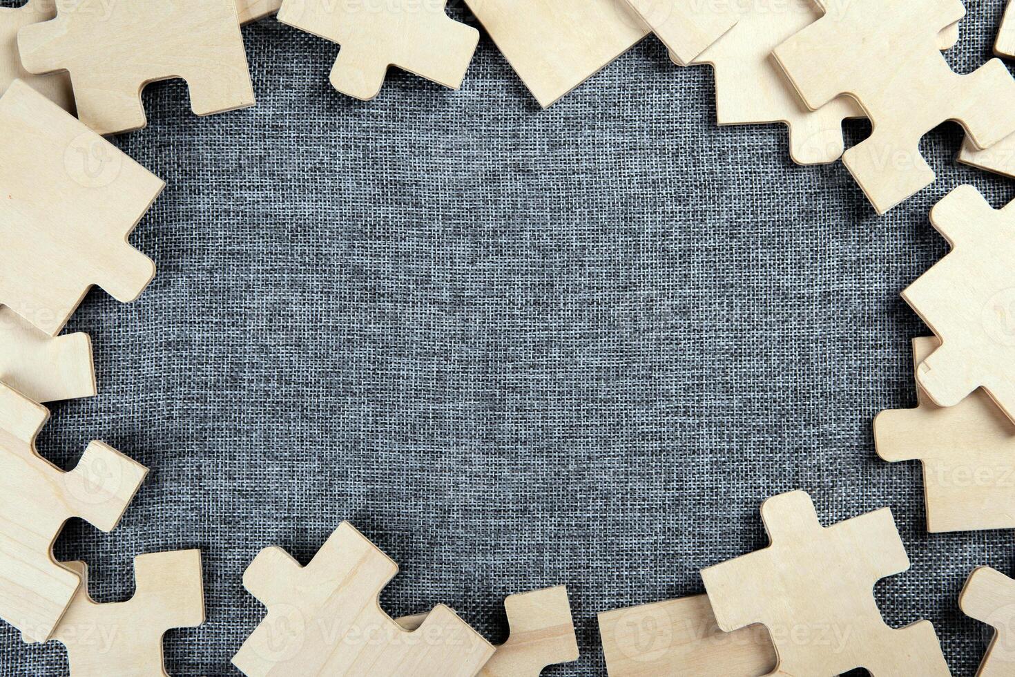 puzzle elements on a textile background as a riddle photo