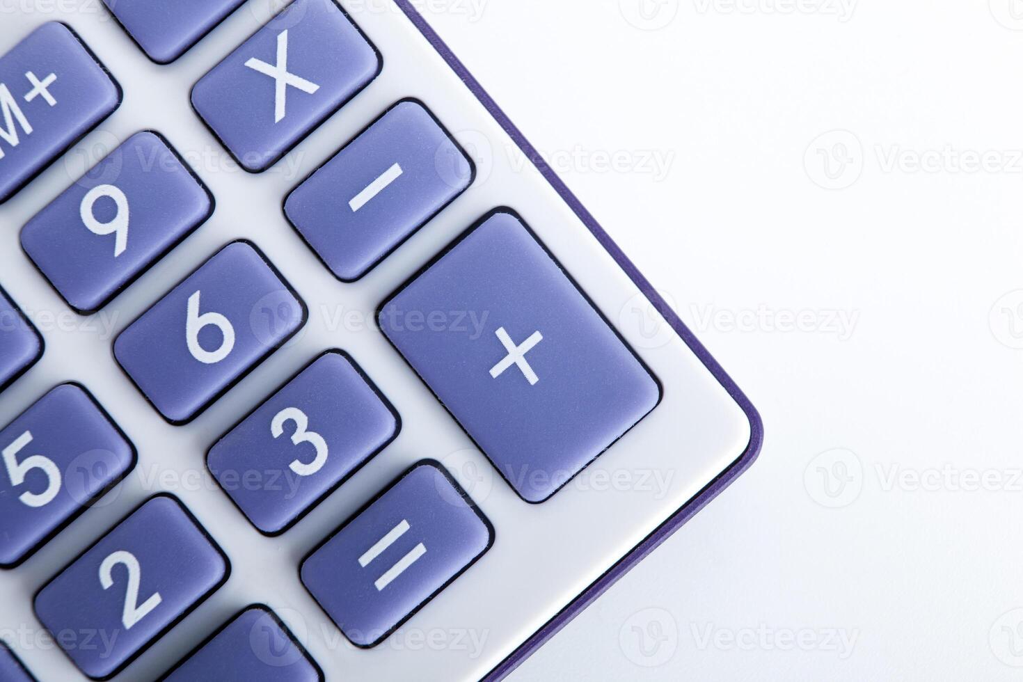 calculator with blue buttons on a white background photo