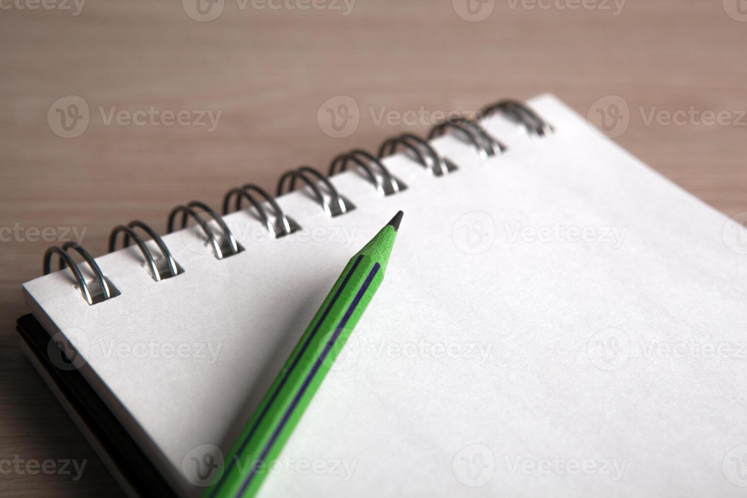 open notebook with the one simple pencil photo