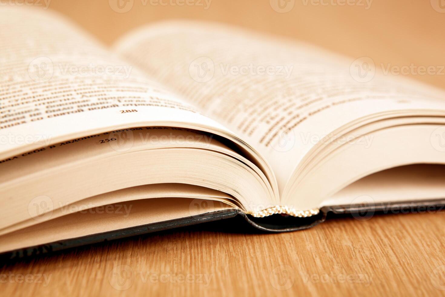 new open book on a wooden table photo