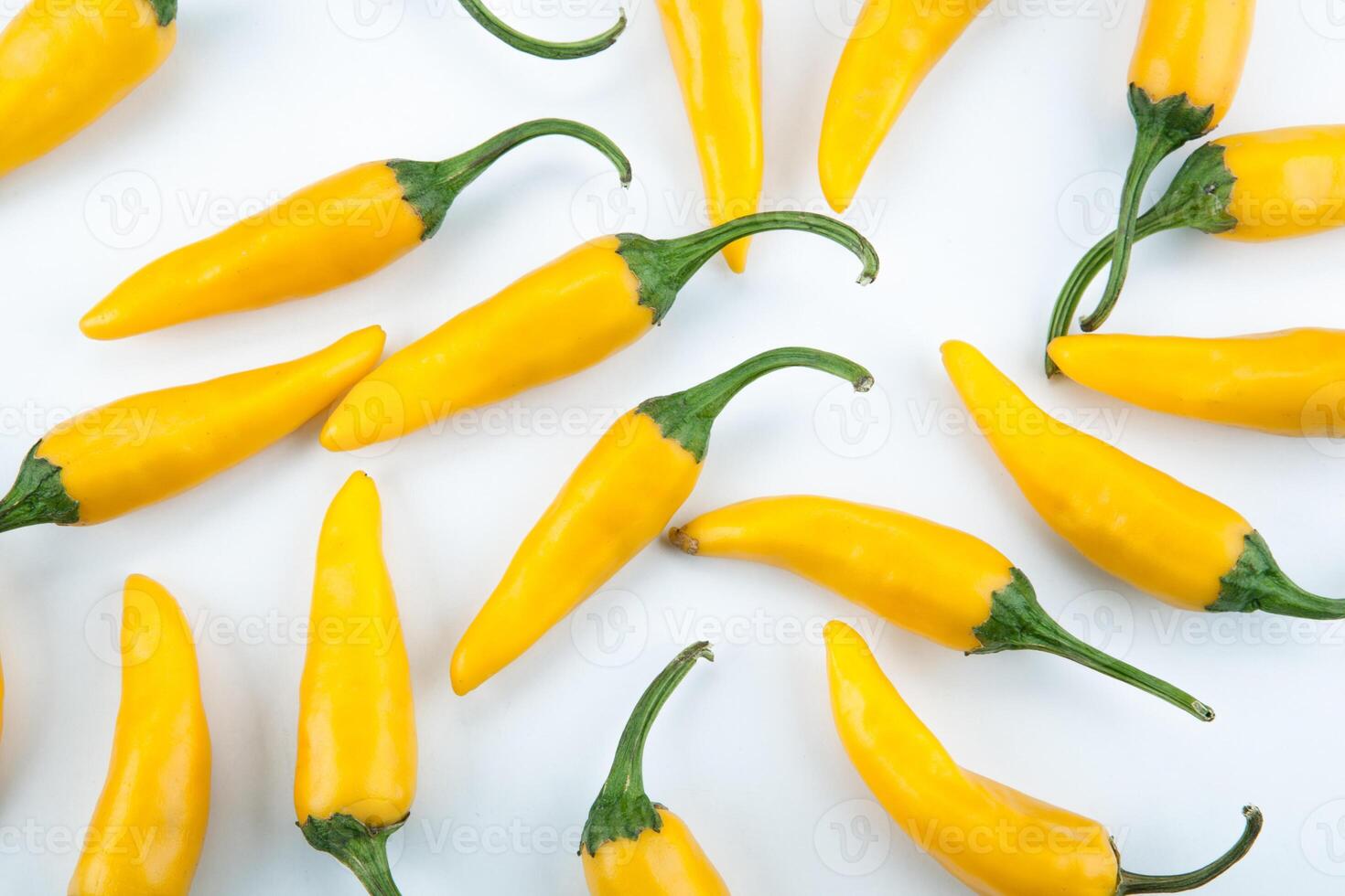fruits of golden fresh chilli pepper on a white background photo