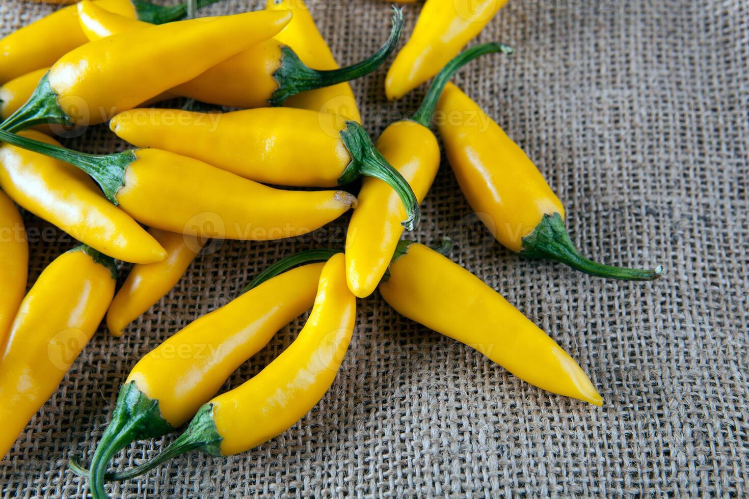 fruits of yellow fresh chilli pepper on the background of the bag photo