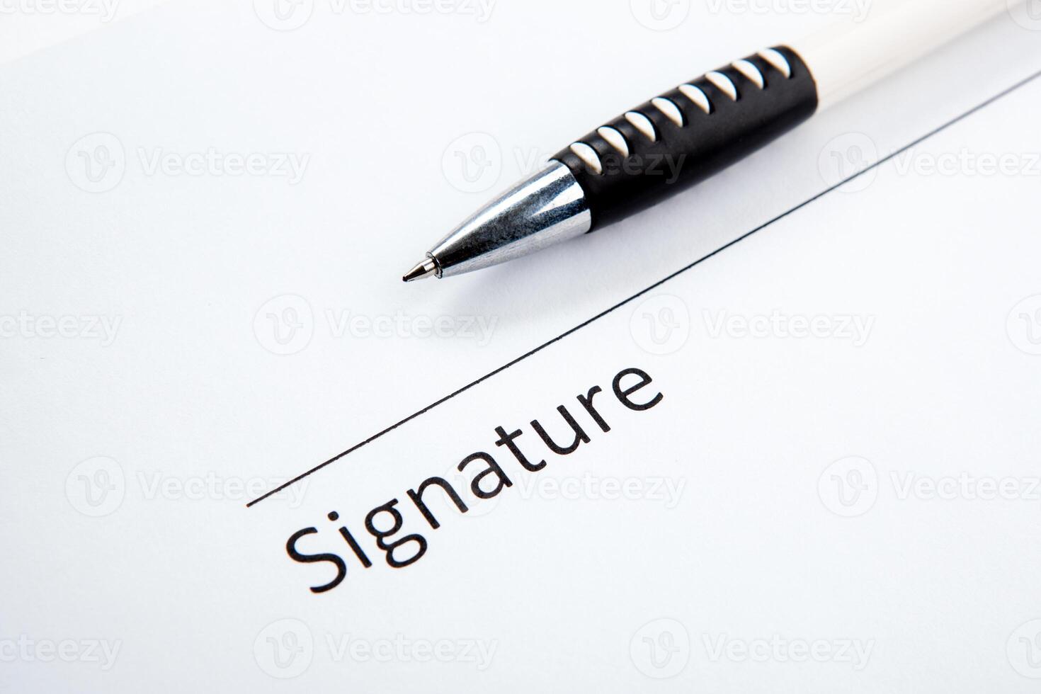 One document with a place for a signature and a pen photo