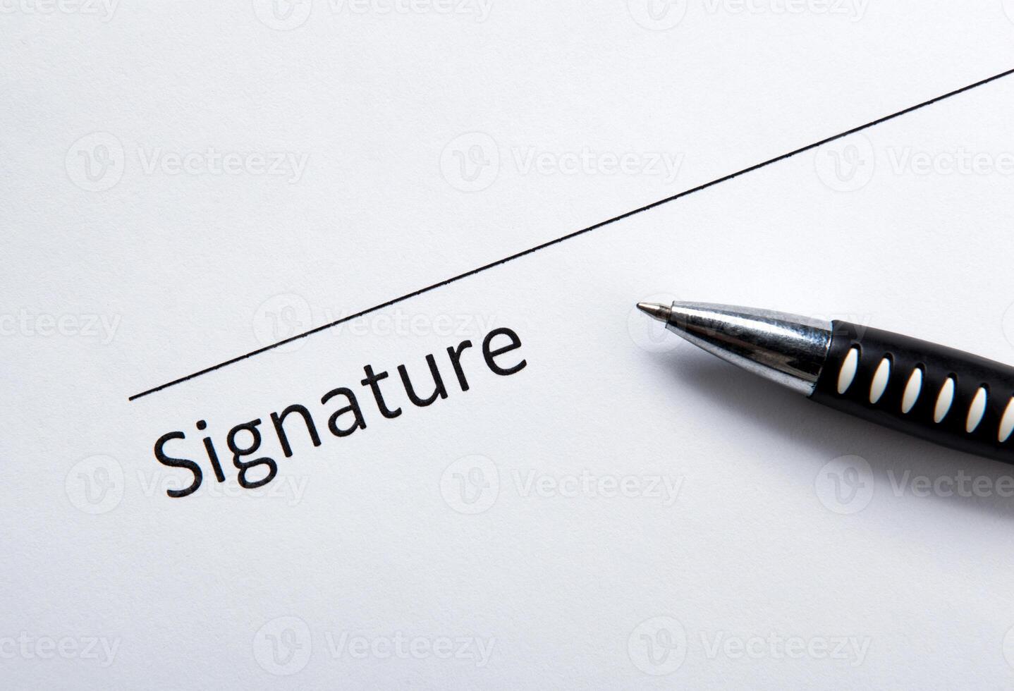 One document with a place for a signature and a pen photo
