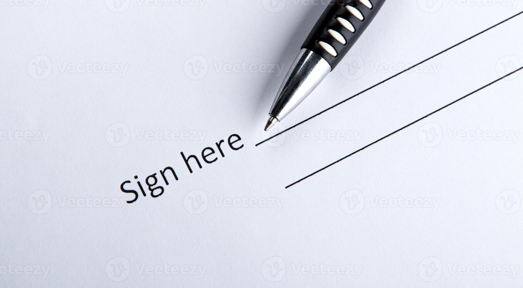 One document with a place for a signature and a pen photo