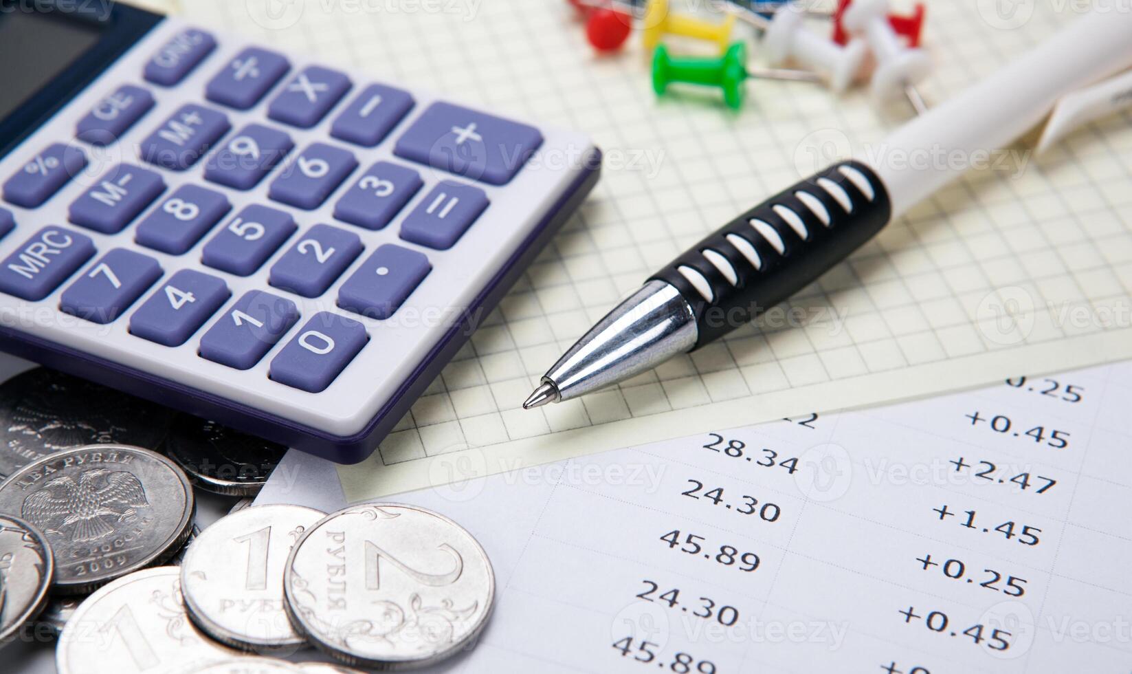 Russian rubles with calculator and a pen and digits photo