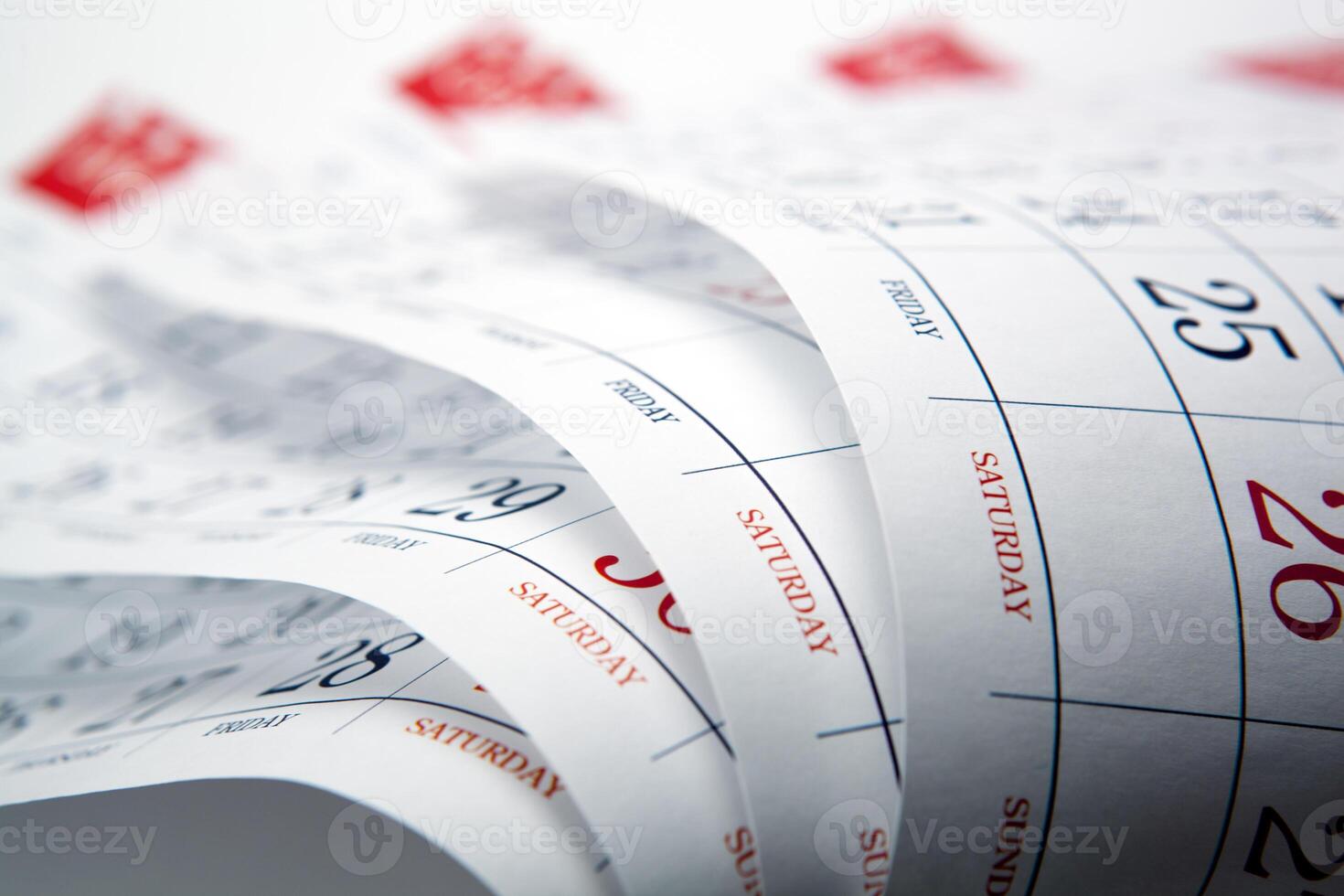 big pile of wall calendar sheets closeup photo