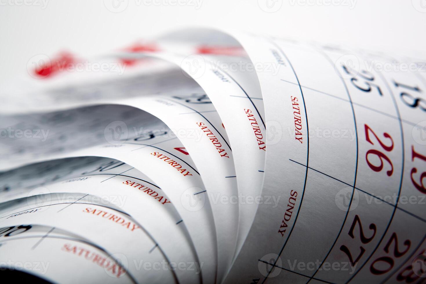 big pile of wall calendar sheets closeup photo
