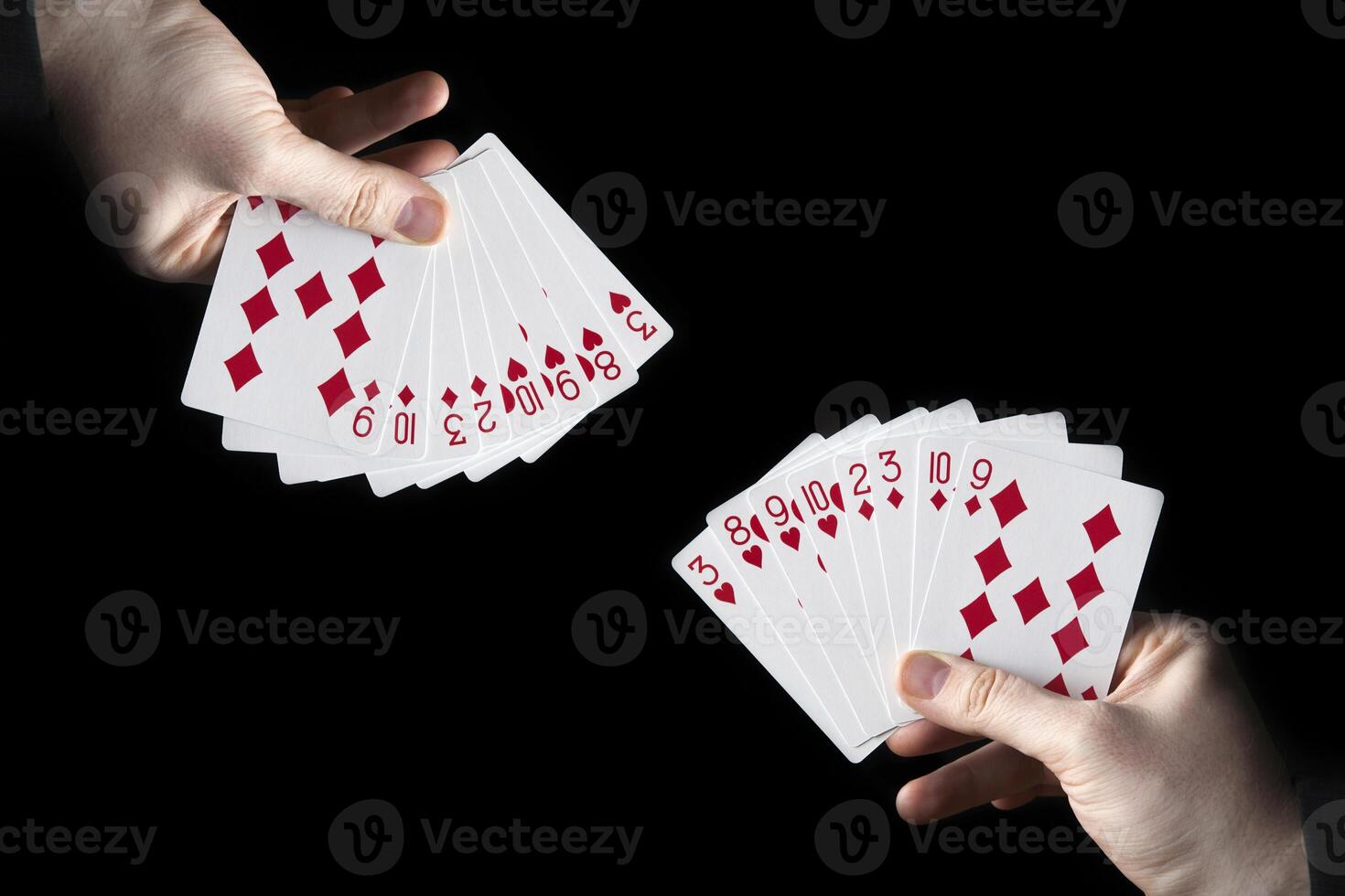 male hands hold a fan of playing cards photo