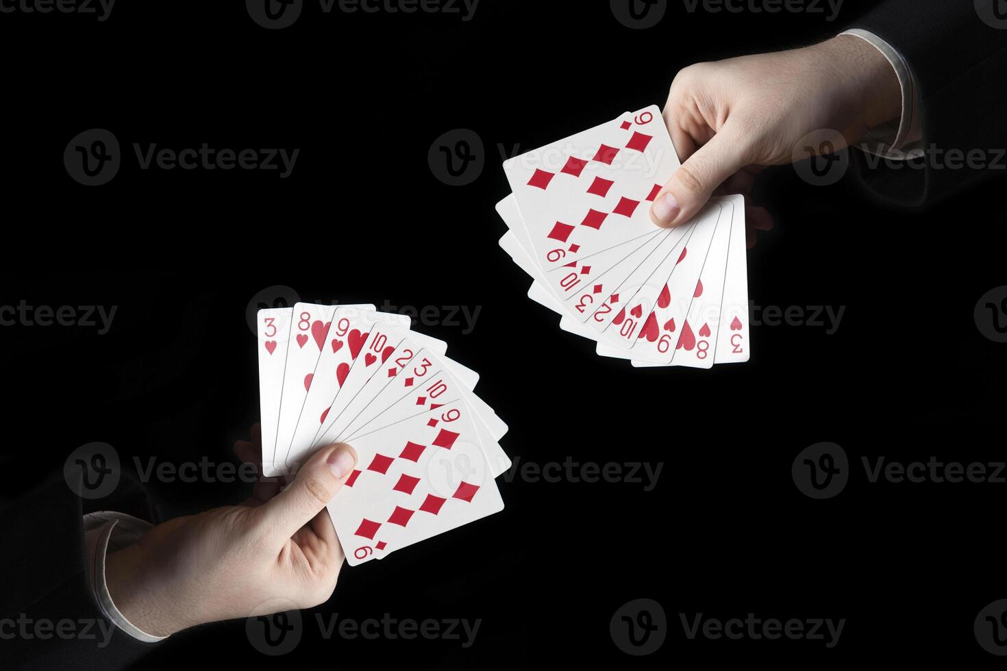 male hands hold a fan of playing cards photo