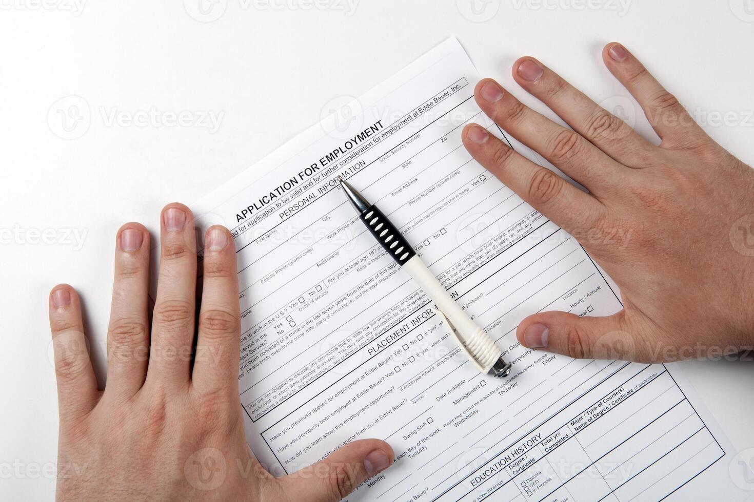 human hand and the form of the document application for employment photo