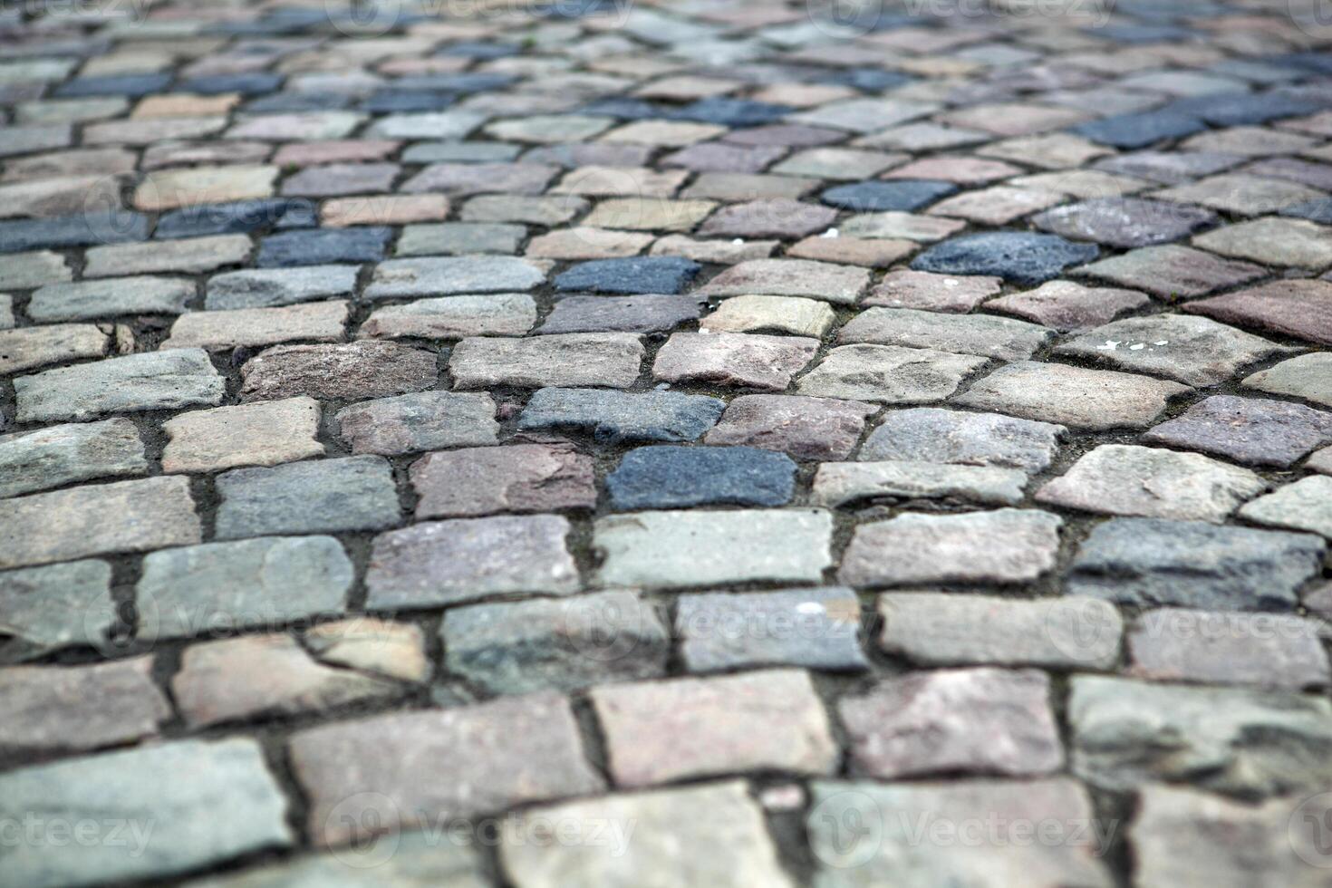 Abstract background of old cobblestone pavement photo