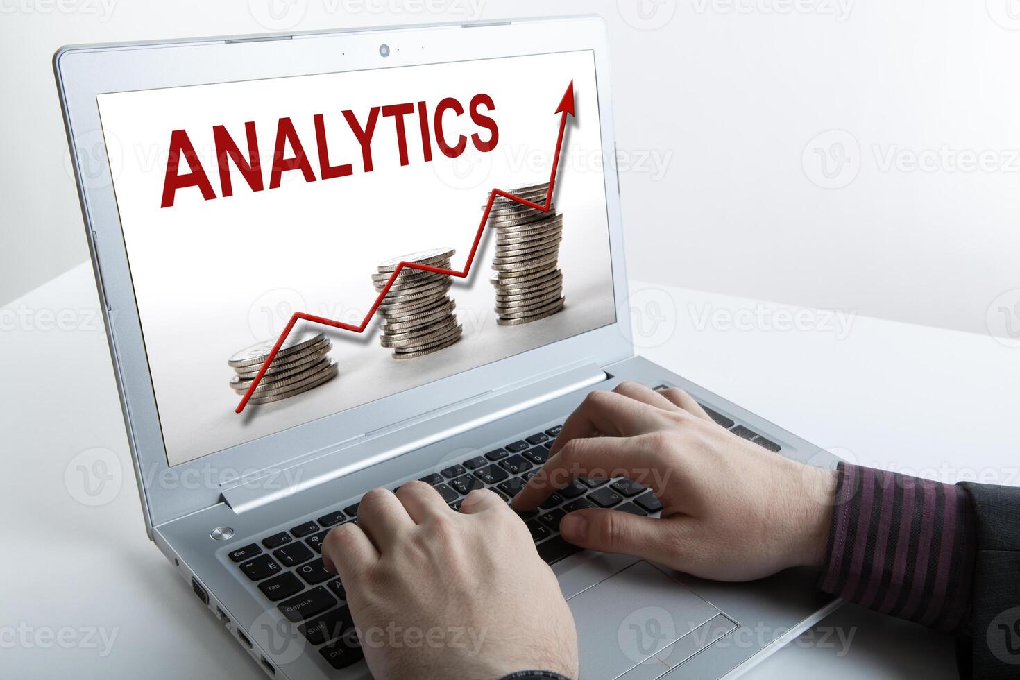 businessman working at a laptop analytics forecasting calculations photo