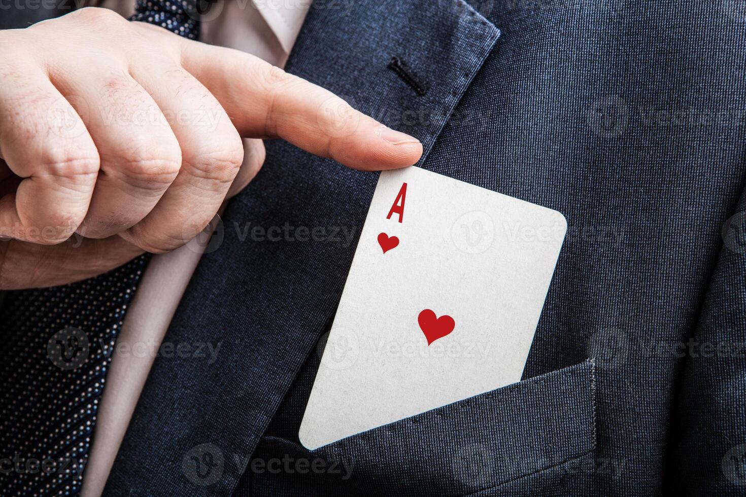 hand pulls the card ace of hearts photo
