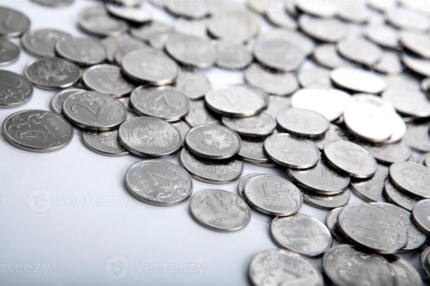pile of coins on a white photo