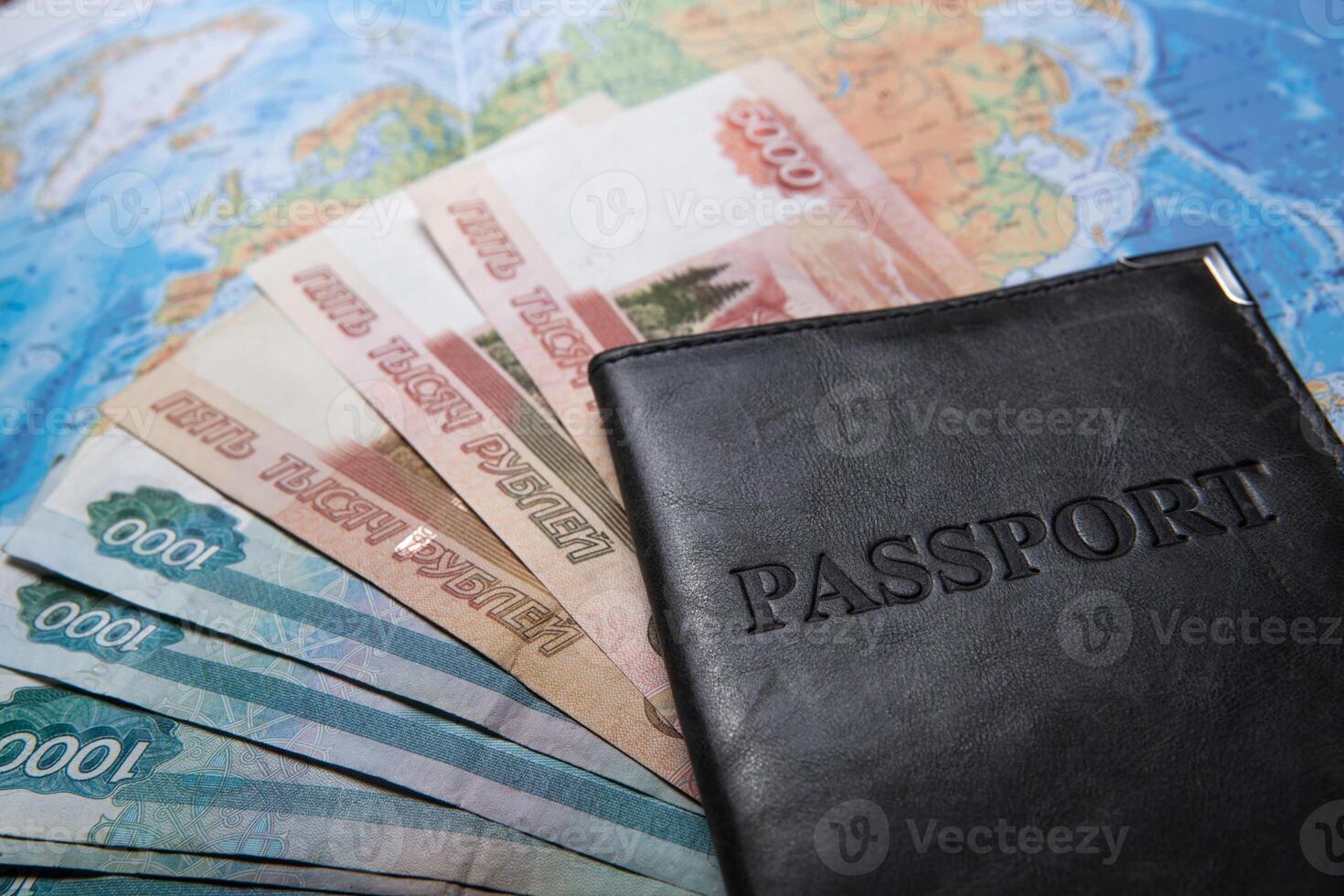 passport in the bag on a map with bank notes photo