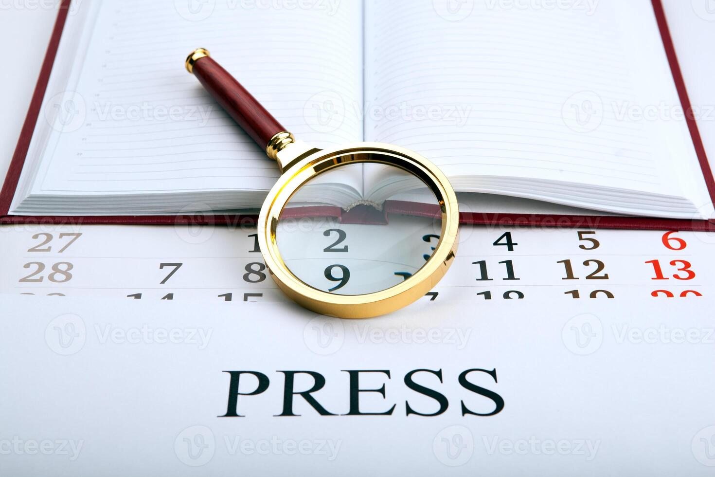 Magnifier and sign the press photo