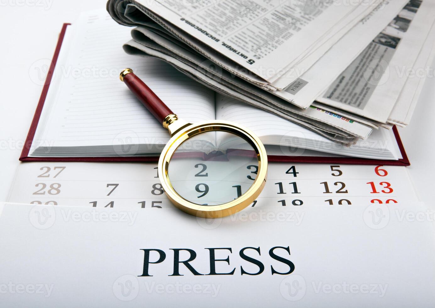 Magnifier and sign the press photo