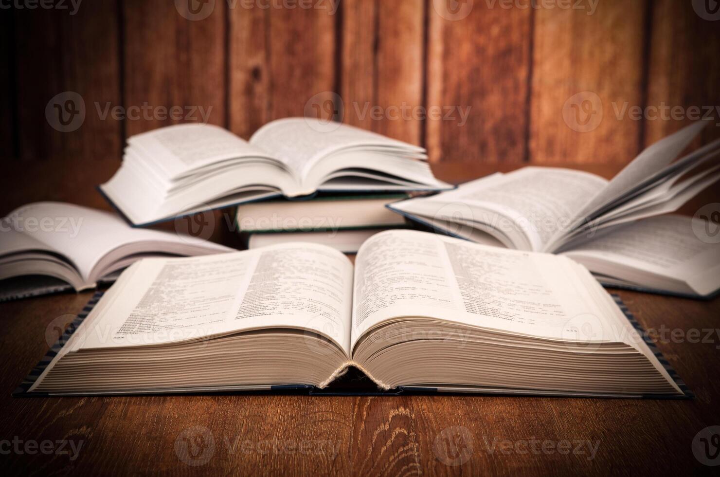 open large book on a wood table photo