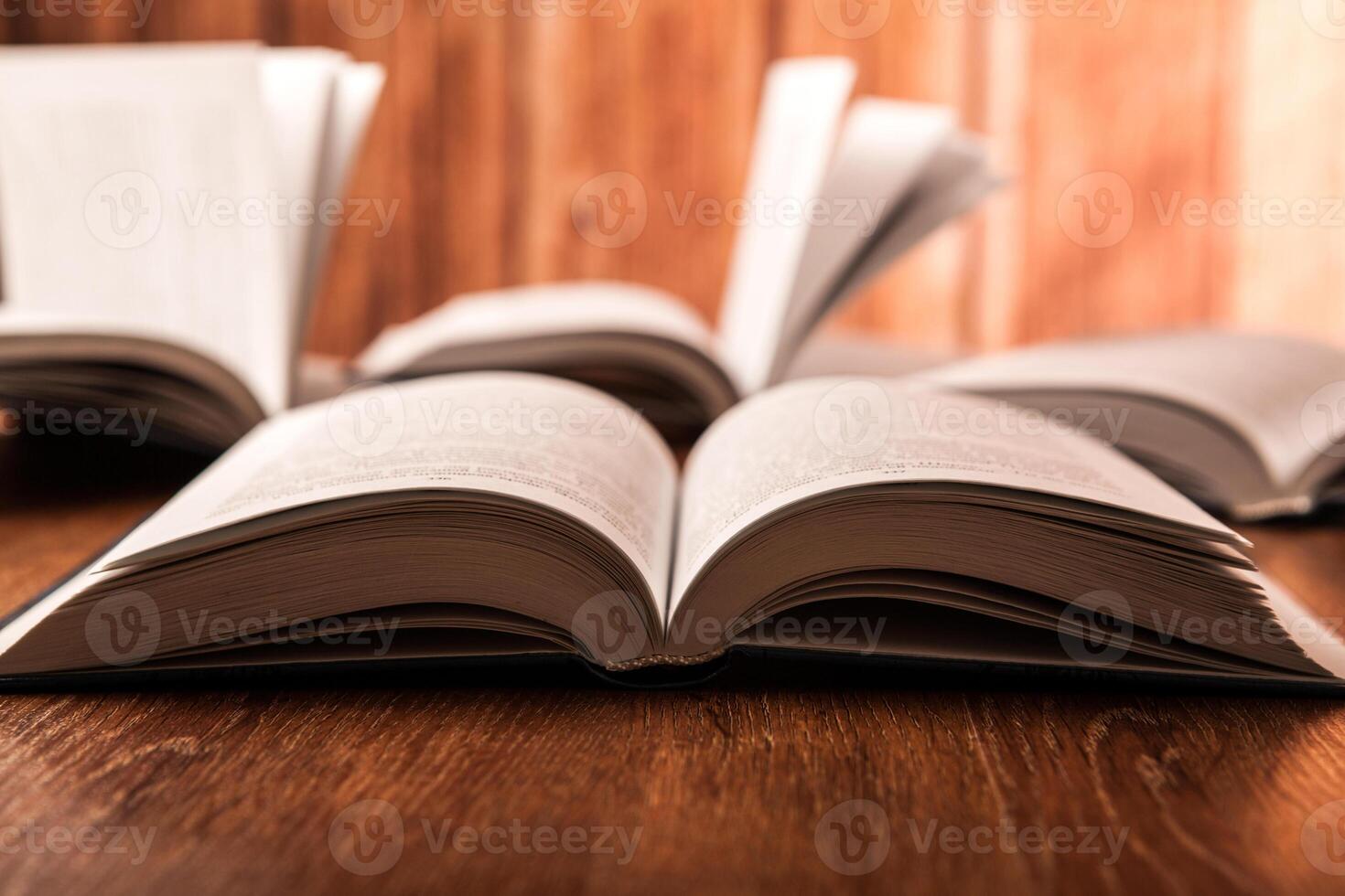 open large book on a wood table photo