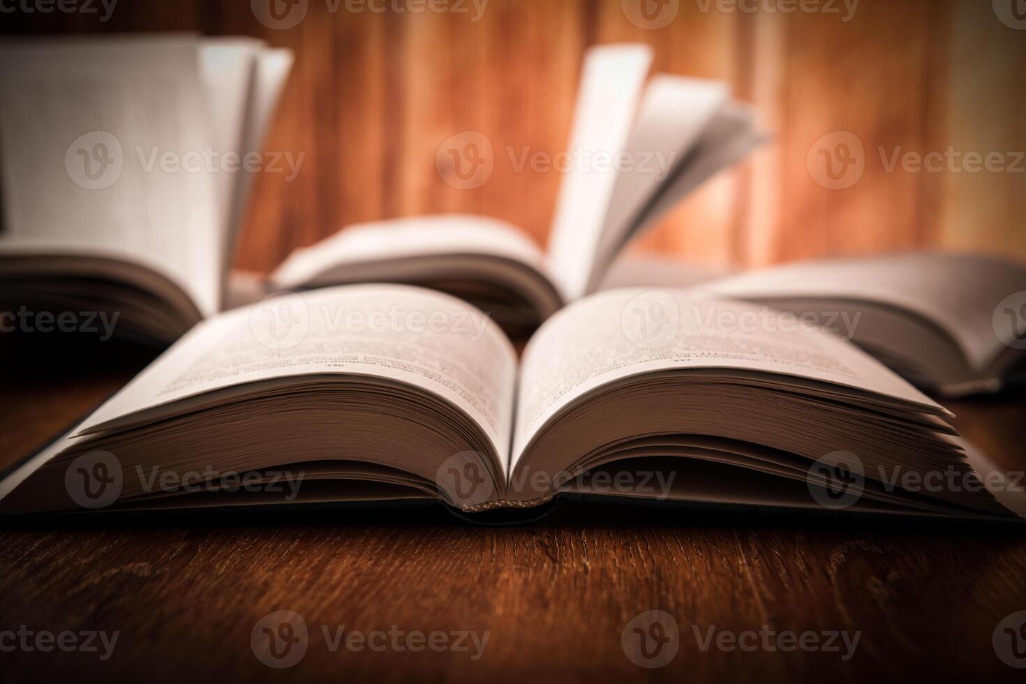 open large book on a wood table photo
