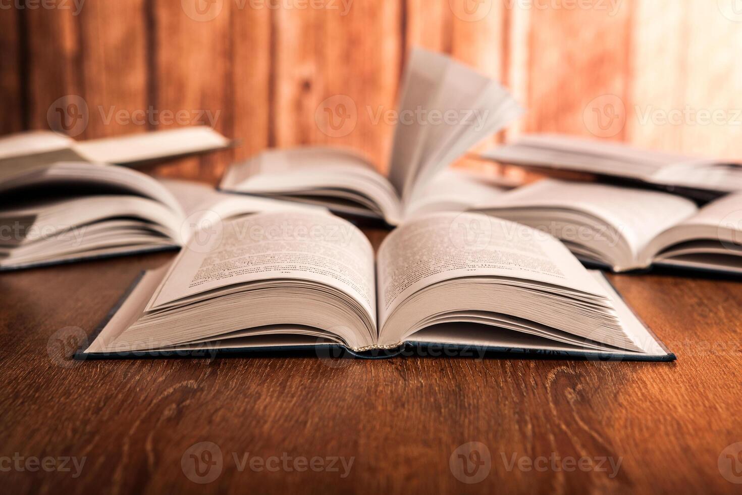 open large book on a wood table photo