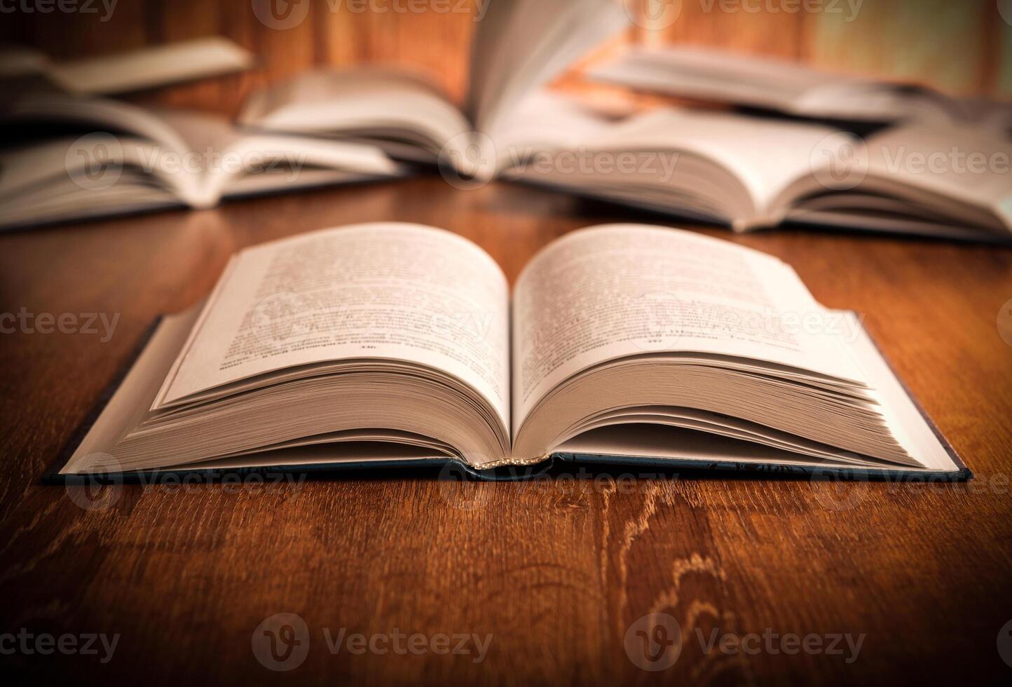open large book on a wood table photo