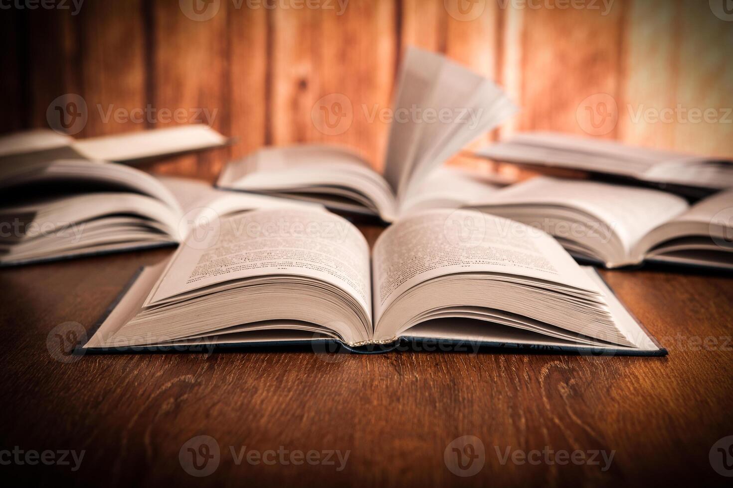 open large book on a wood table photo
