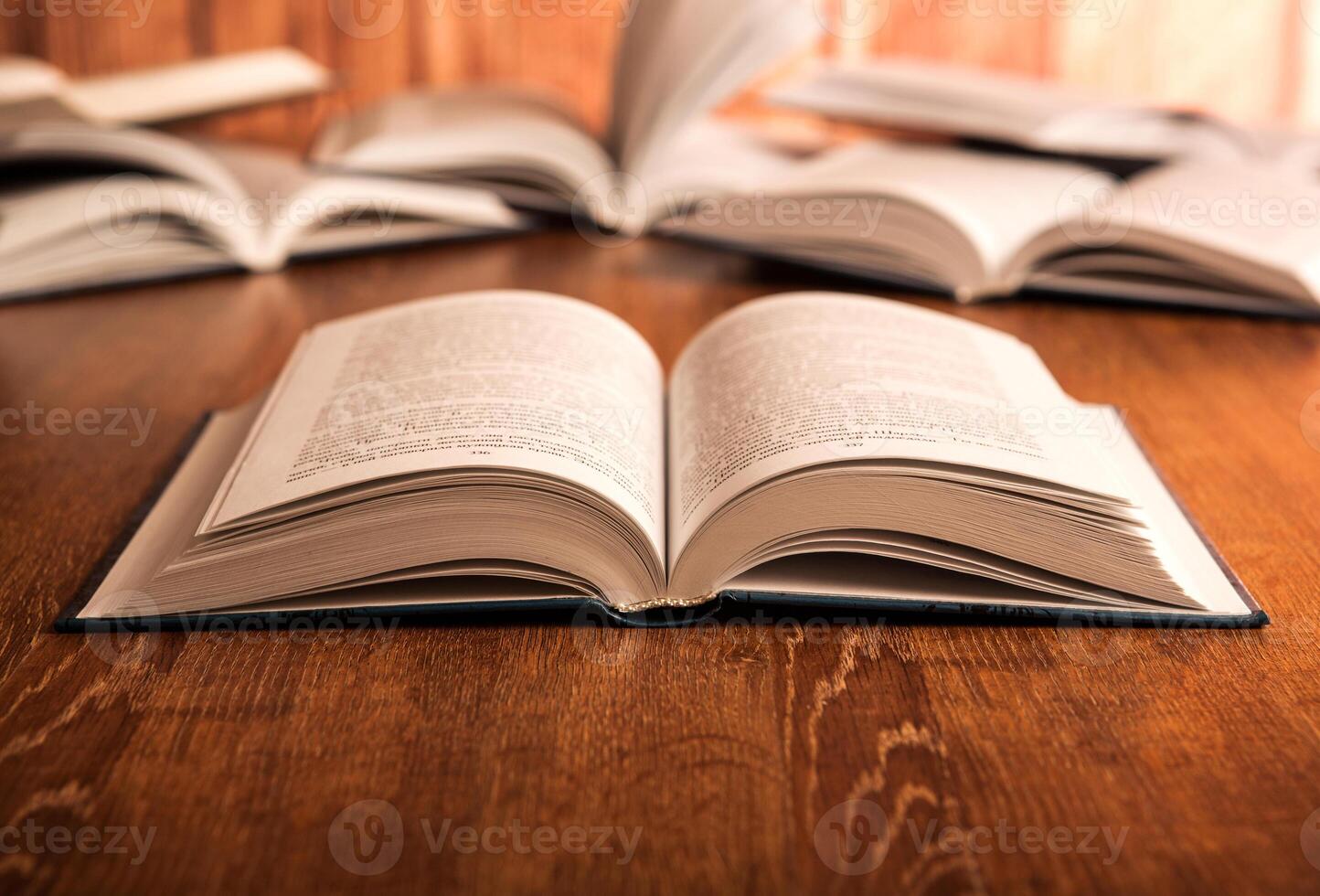open large book on a wood table photo