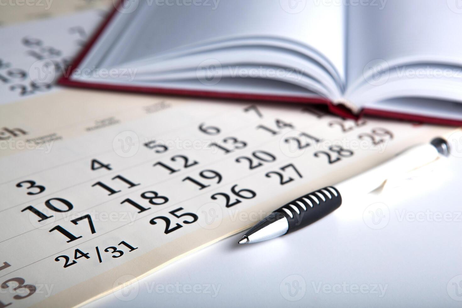 calendar days with numbers and pen photo