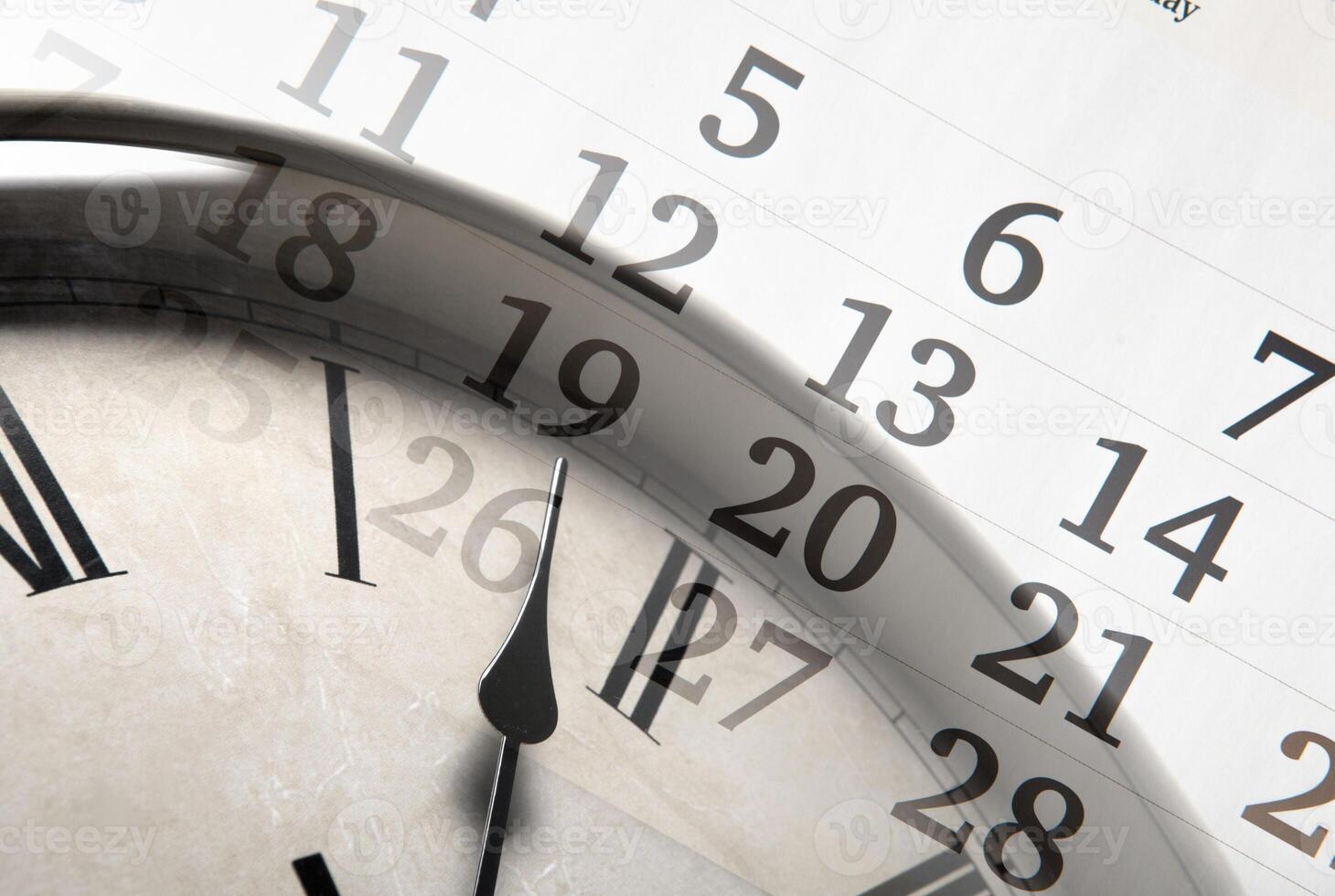sheet of a calendar with the number of days and clock photo