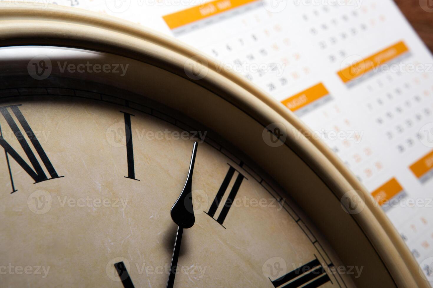 sheet of a calendar with the number of days and clock photo