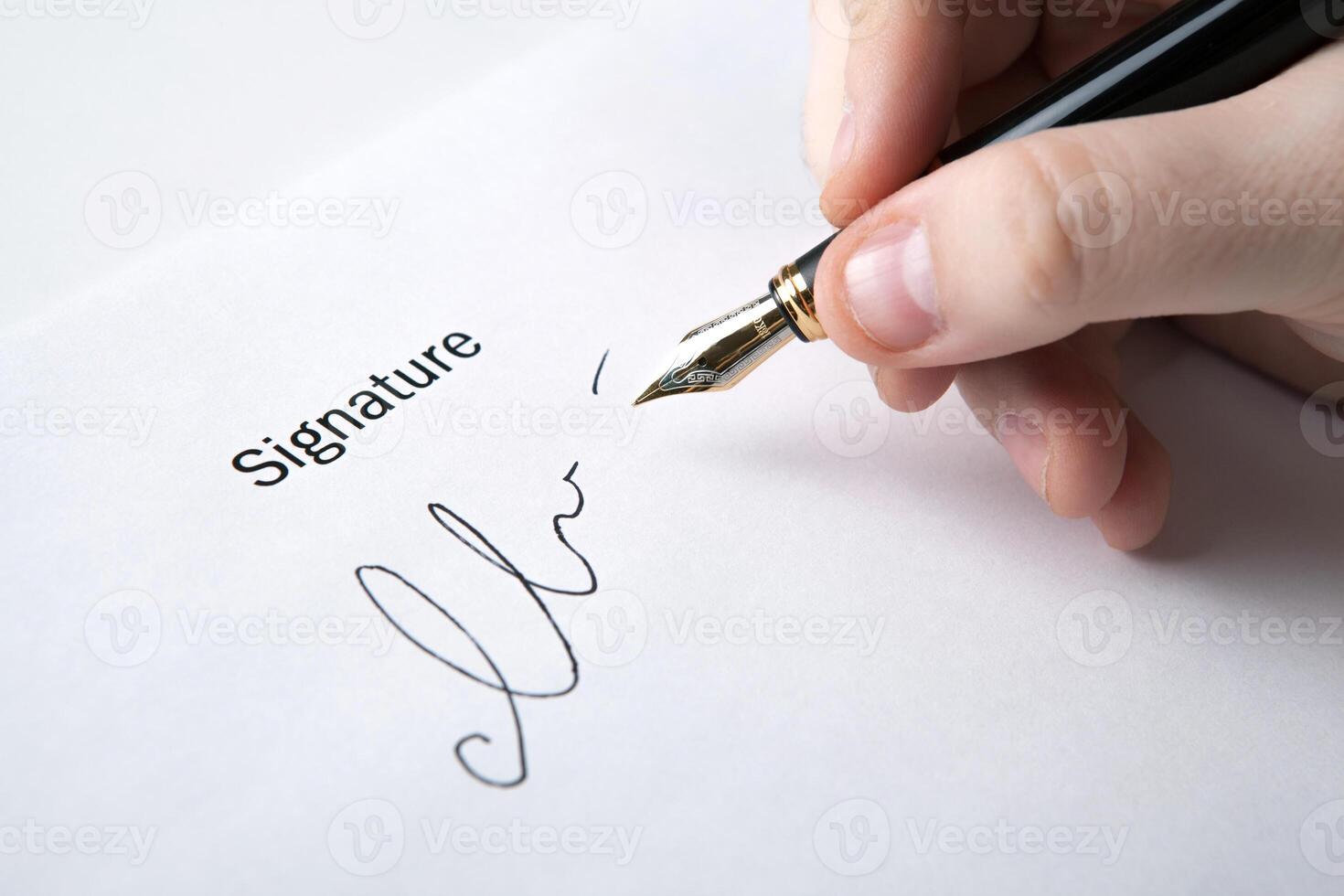 pen in the man's hand and signature photo