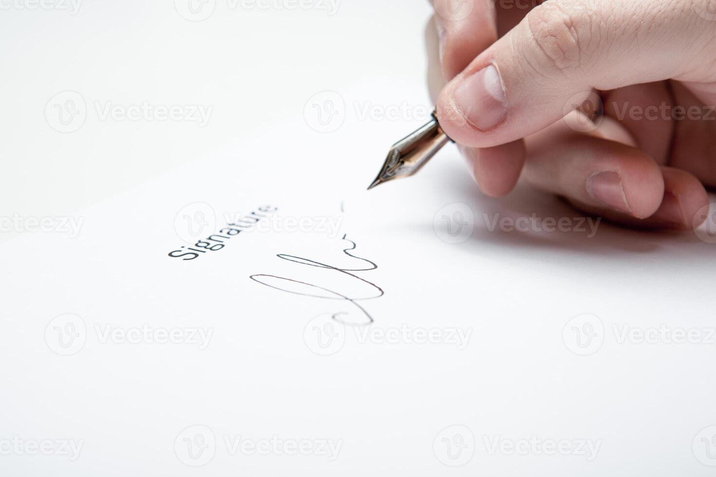 pen in the man's hand and signature photo