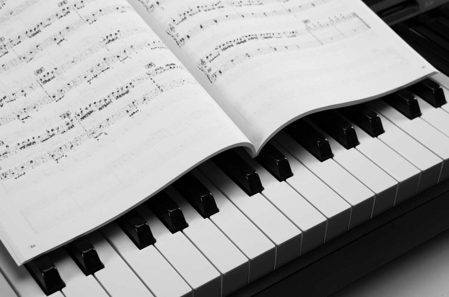 Piano keys and musical book photo