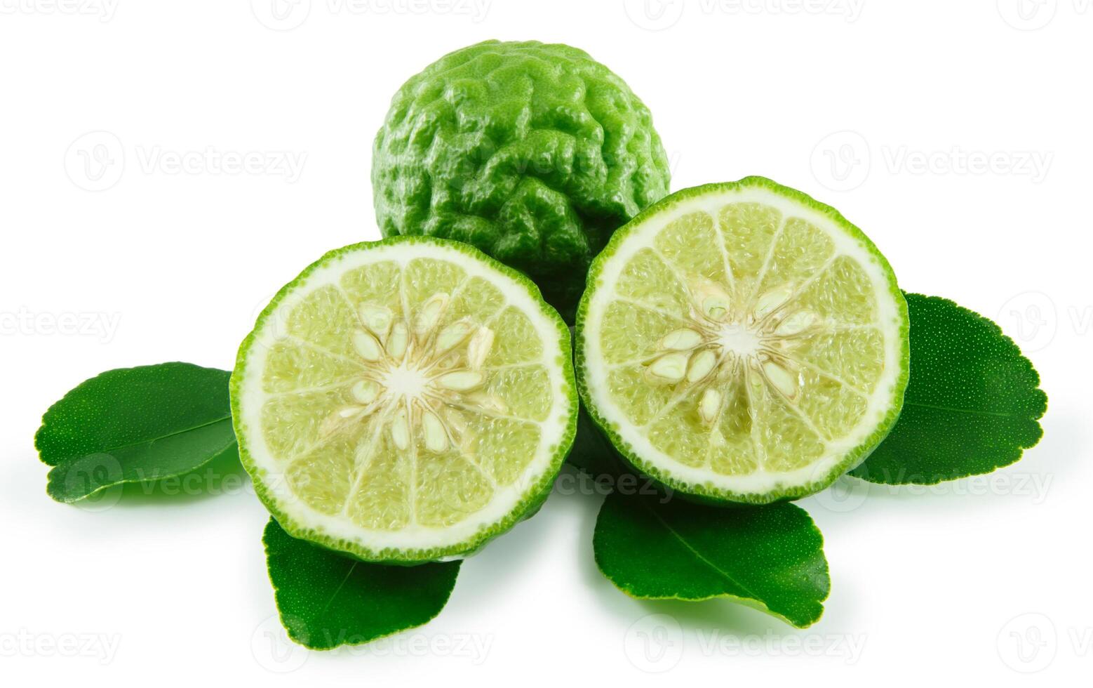 Bergamot and kaffir lime leaves on white background photo