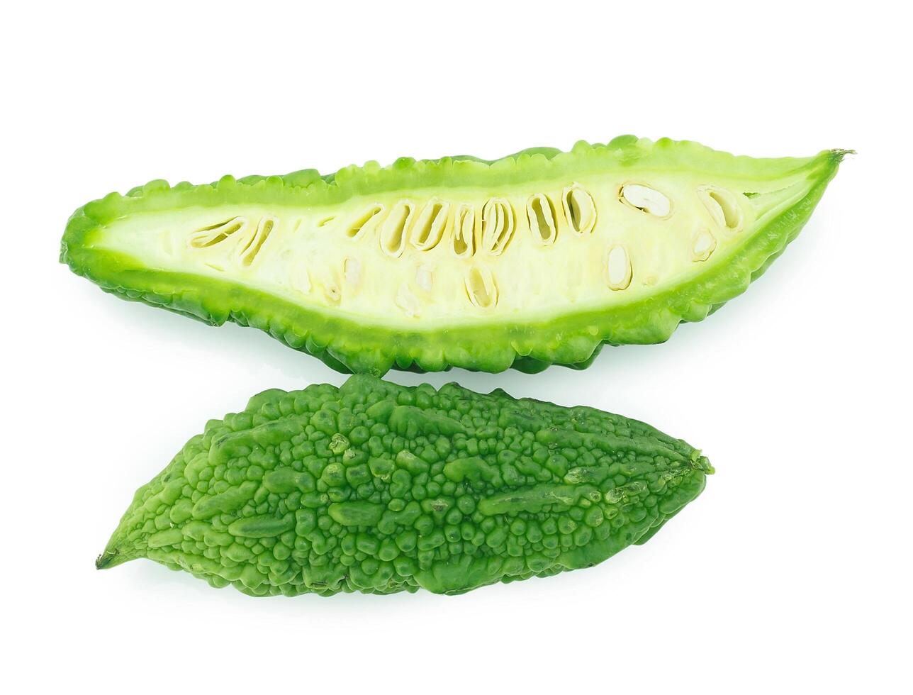 slices of bitter gourd arranged on white background photo