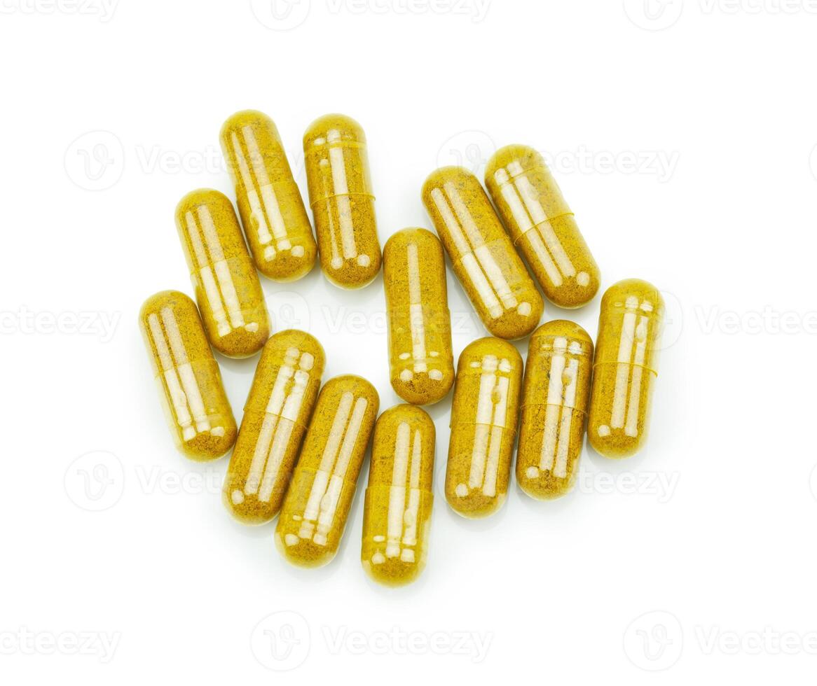 Turmeric capsule powder on white background photo