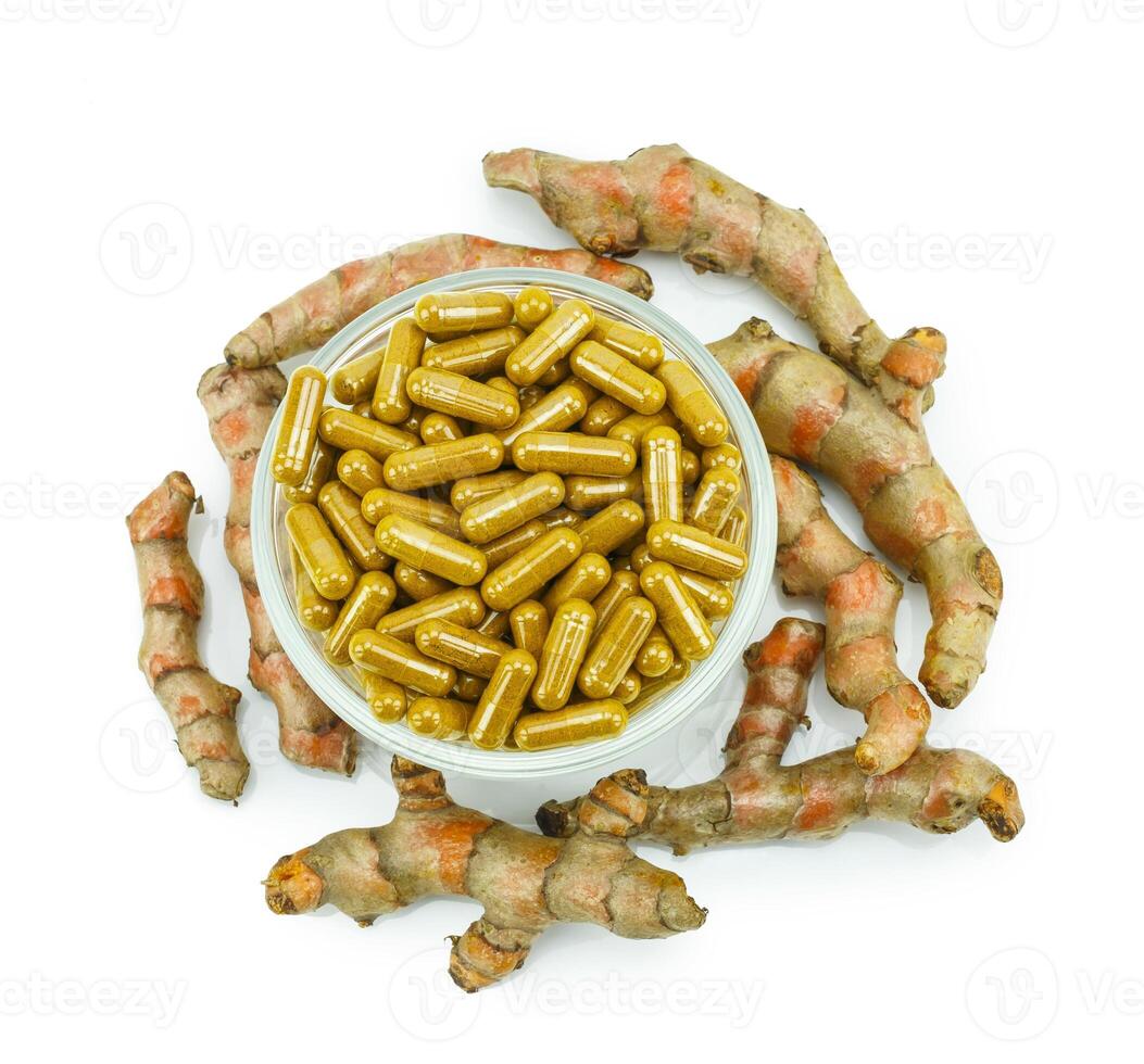 Turmeric root and turmeric capsule powder for alternative medicine ,spa products and food ingredient. photo