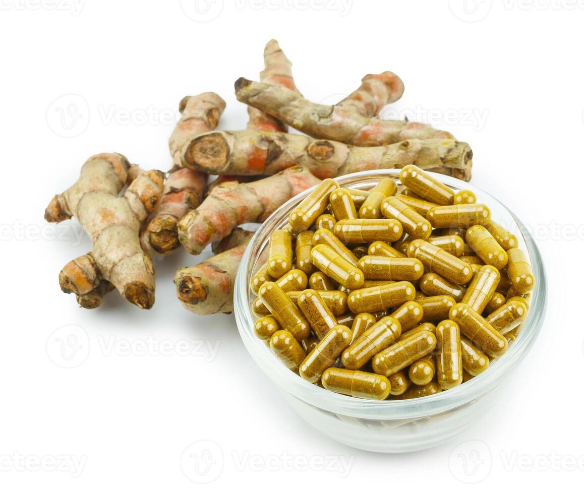 Turmeric root and turmeric capsule powder for alternative medicine ,spa products and food ingredient. photo