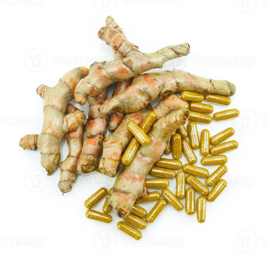 Turmeric root and turmeric capsule powder for alternative medicine ,spa products and food ingredient. photo
