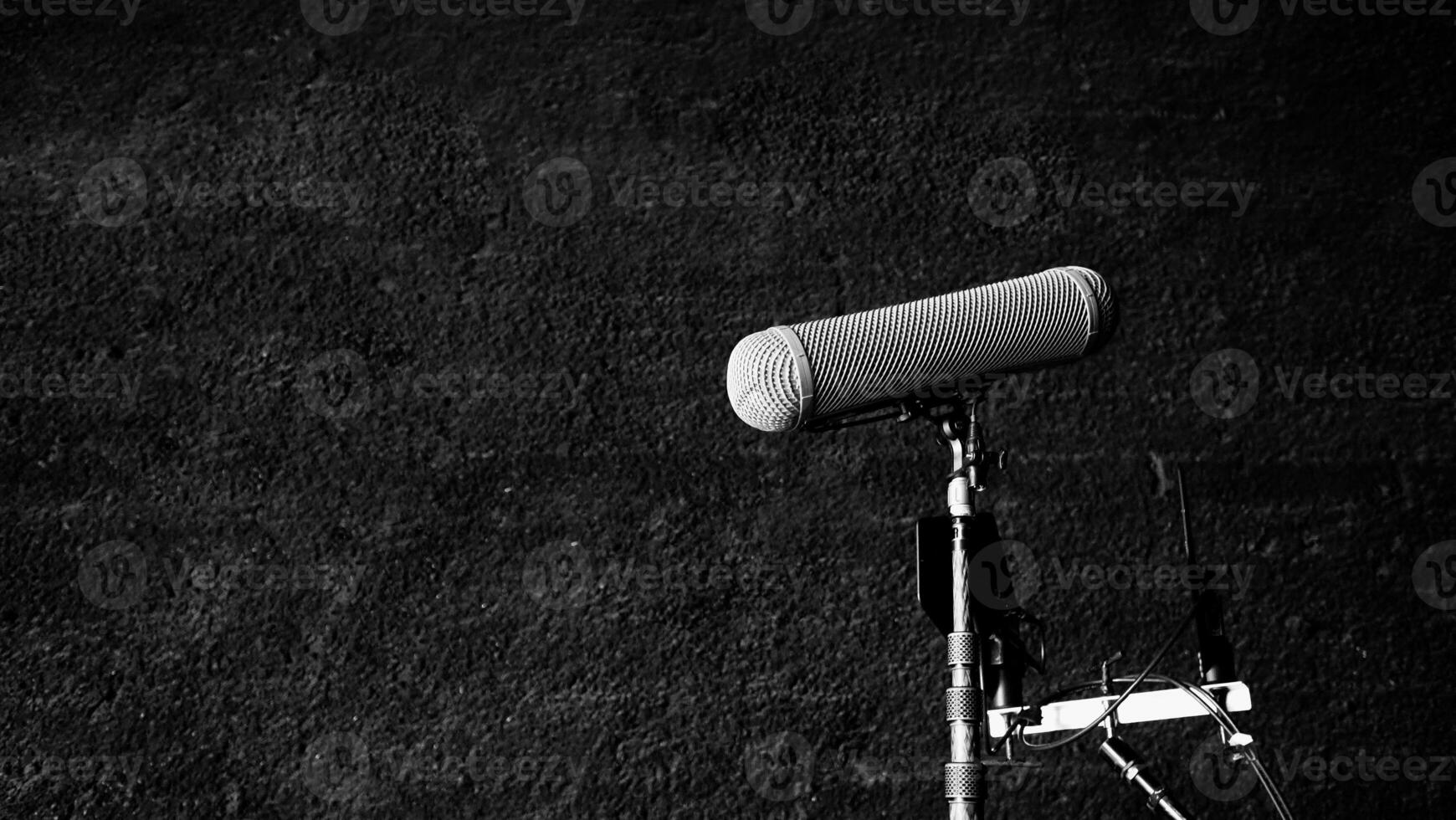 Boom Microphone on stand in Production which recording audio and ambient sound in studio. photo