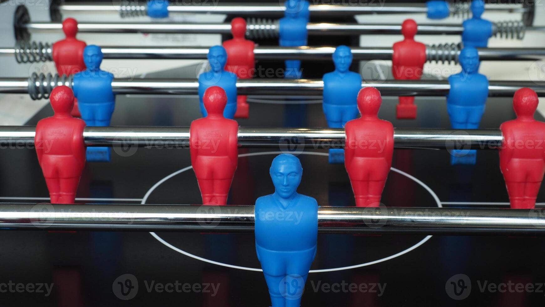 Football table or soccer table game with plastic player figurine. Mini Soccer game which famous in past and be collectable item for foosball lover. Play by two hand control each row of player figurine photo