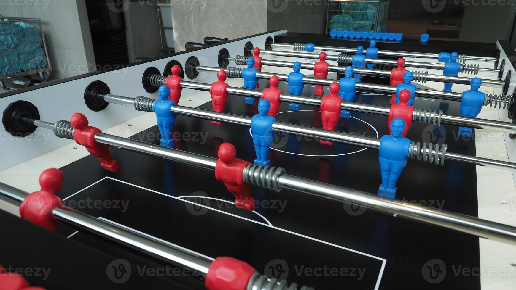 Football table or soccer table game with plastic player figurine. Mini Soccer game which famous in past and be collectable item for foosball lover. Play by two hand control each row of player figurine photo