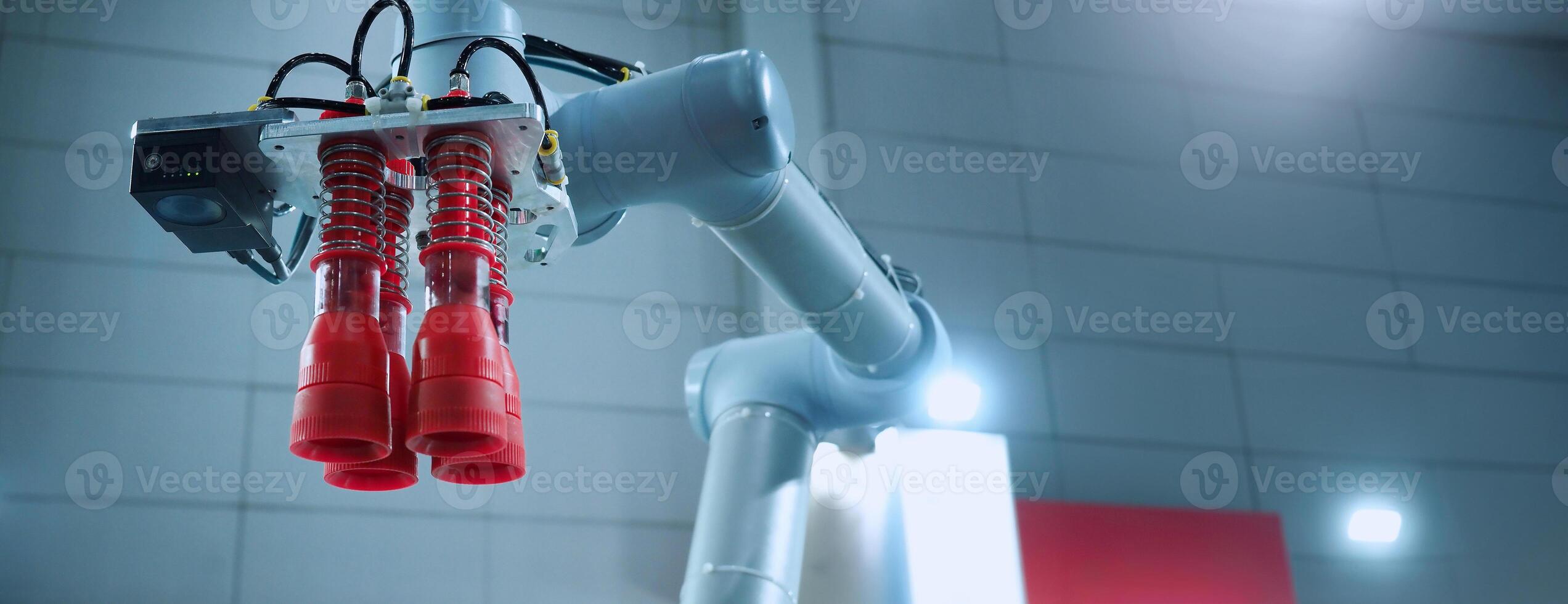 Robot arm Automation technology. Tools for saving energy effort and making the work of engineers more convenient in modern factories. Automation factory tech concept with robotic arms lifting goods. photo