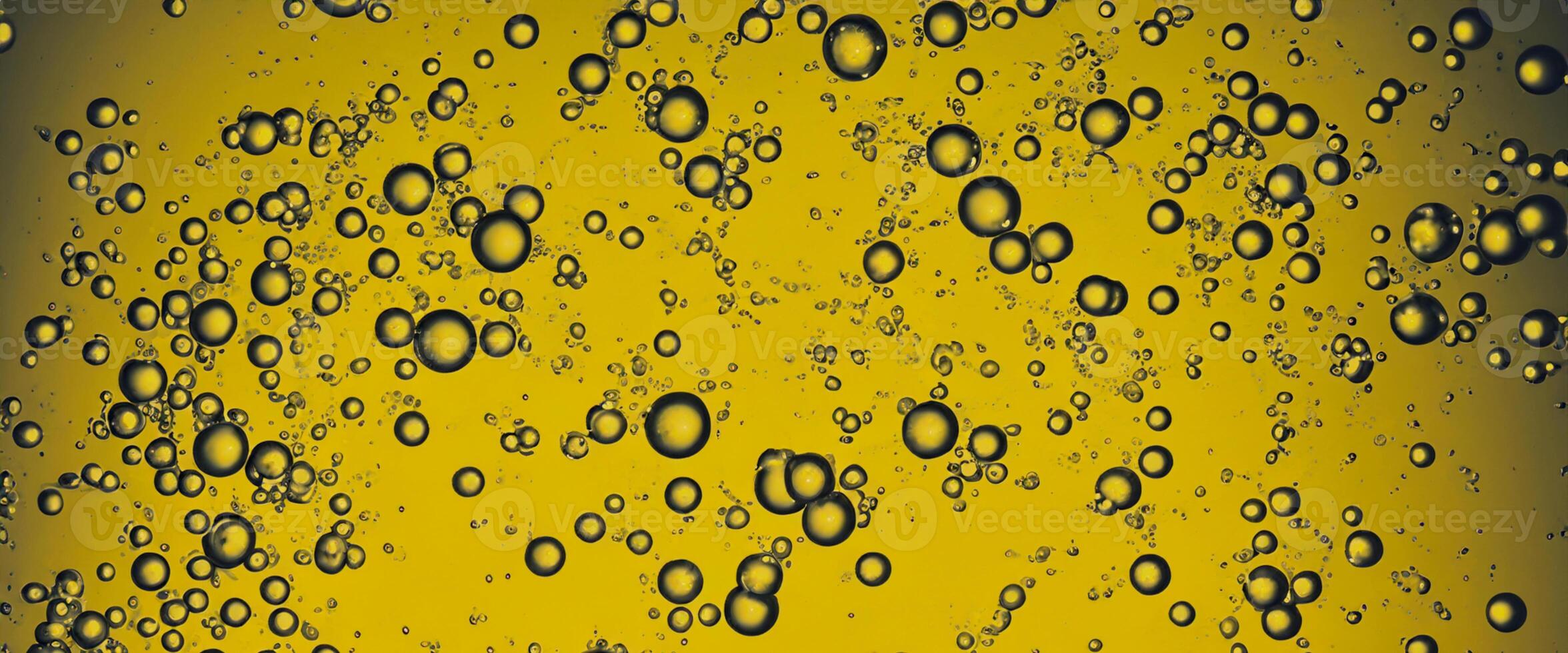 Golden Hyaluron Oil bubbles collagen serum or yellow oil bubbles drop texture background photo