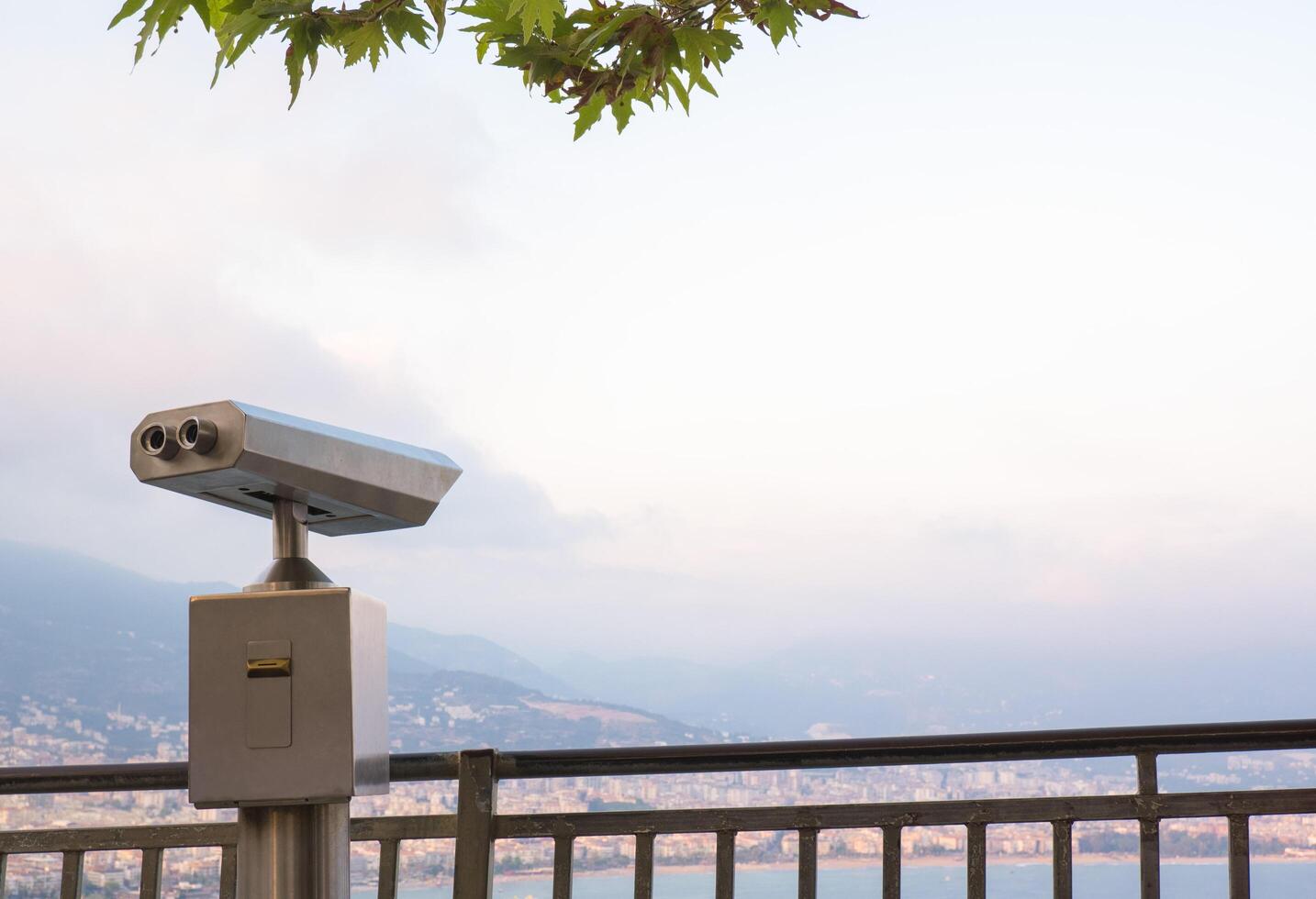 Binocular against observation deck view photo