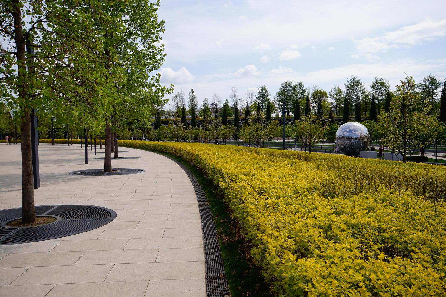 City park Krasnodar. Concrete path in the park. Urban environment photo