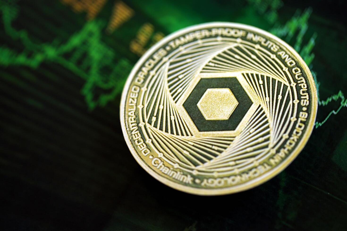 KYIV, UKRAINE - AUGUST 17, 2024 Chainlink LINK coin on dark cryptocurrency digital trading chart in green colors photo