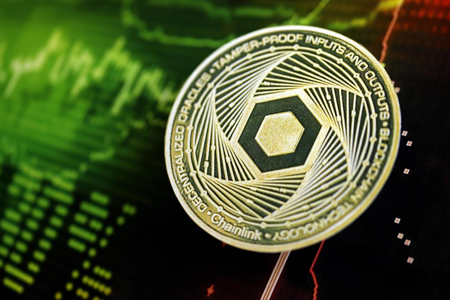 KYIV, UKRAINE - AUGUST 17, 2024 Chainlink LINK coin on dark cryptocurrency digital trading chart in green and red colors photo